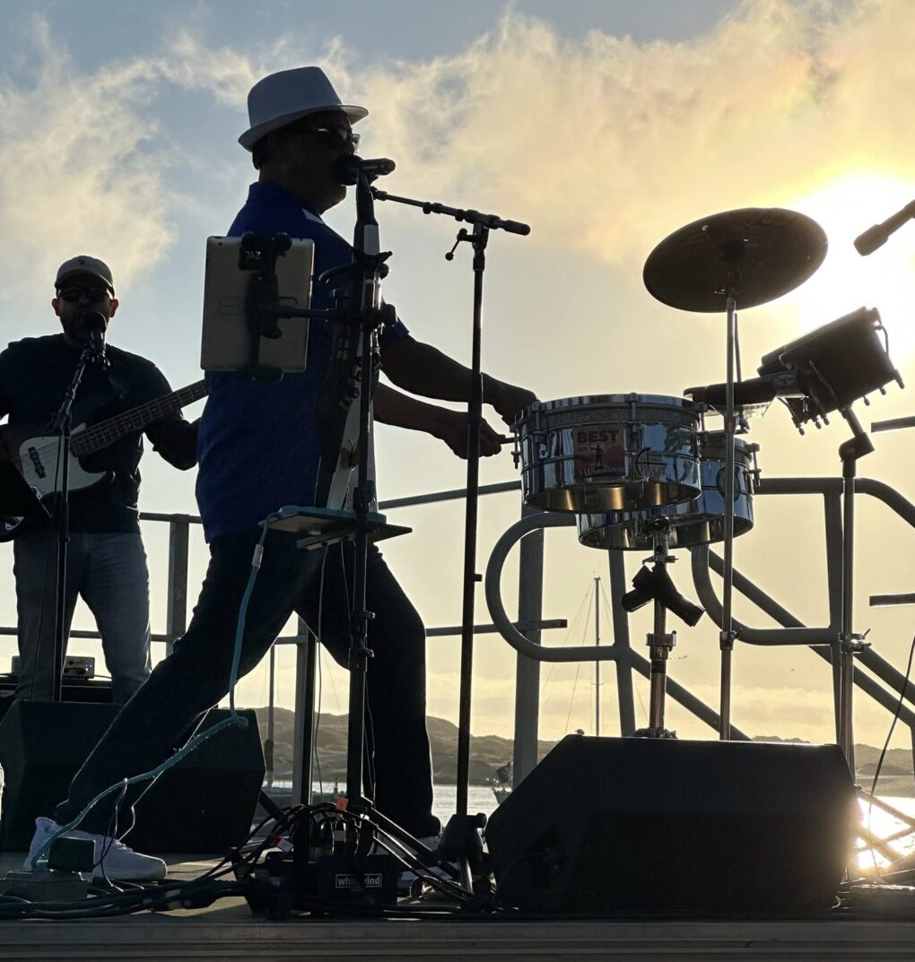 silhouette of man singing at twilight